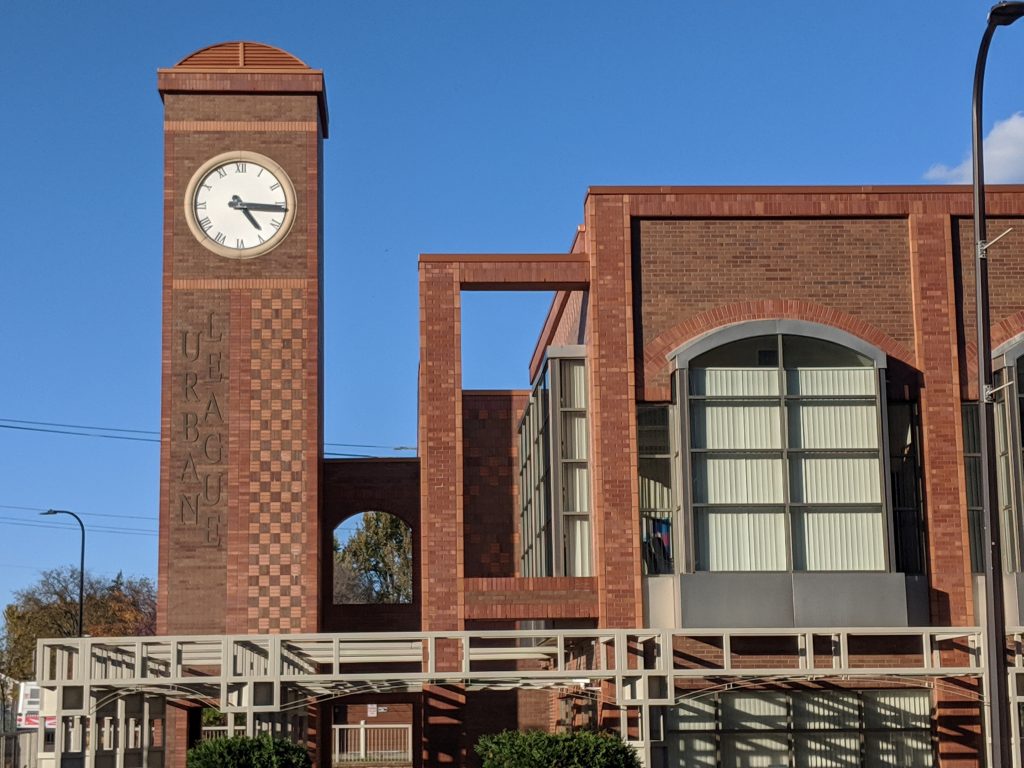 Photo of the Urban League building: a brick building with a clock tower.